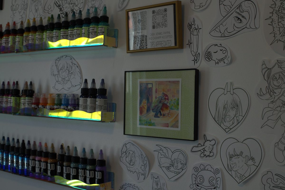 Shelf of tattoo inks and supplies in the studio
